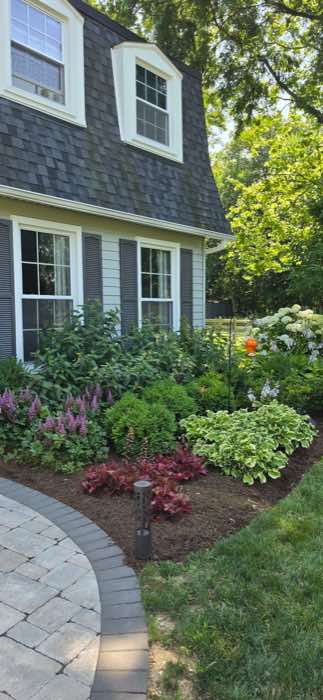 Front garden and paver walkway with fresh mulch