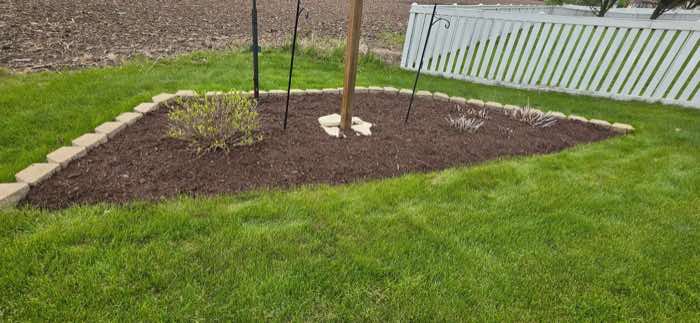 Stone-bordered mulch bed